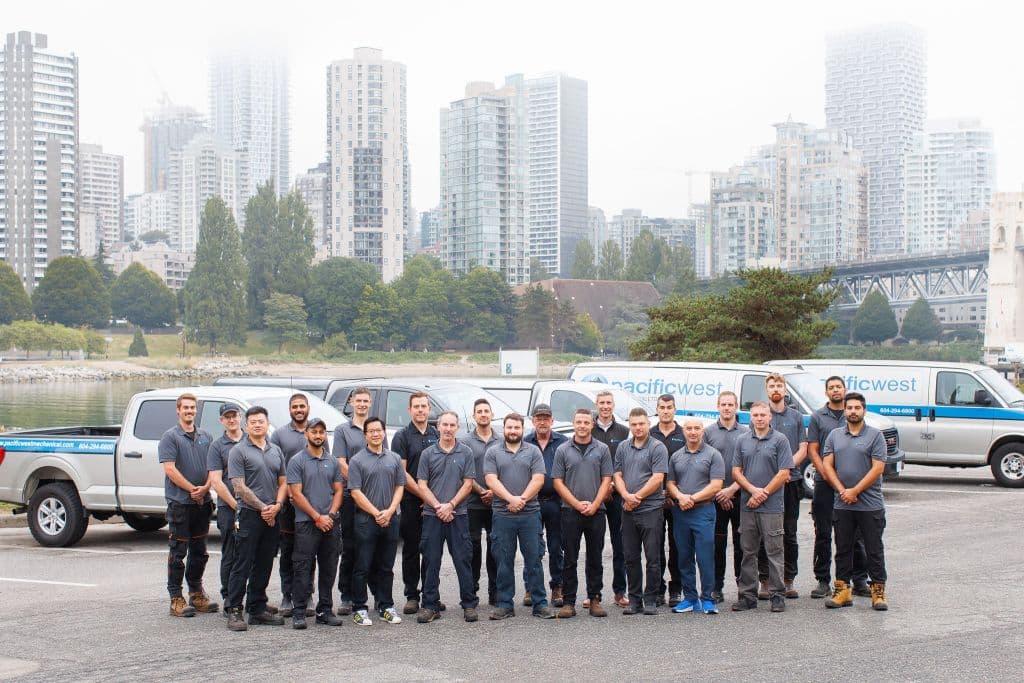The Pacific West Mechanical team in front of their service vehicles